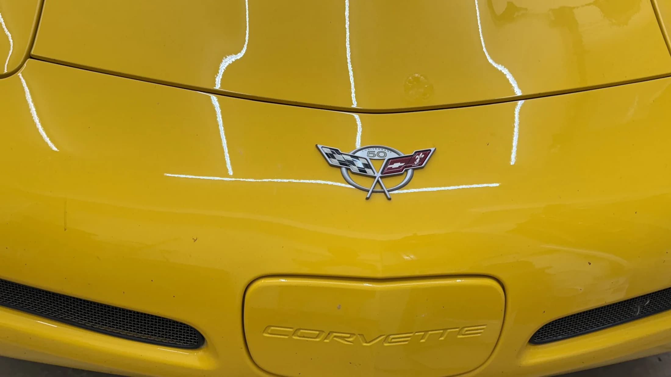 Yellow Corvette front end after detailing.