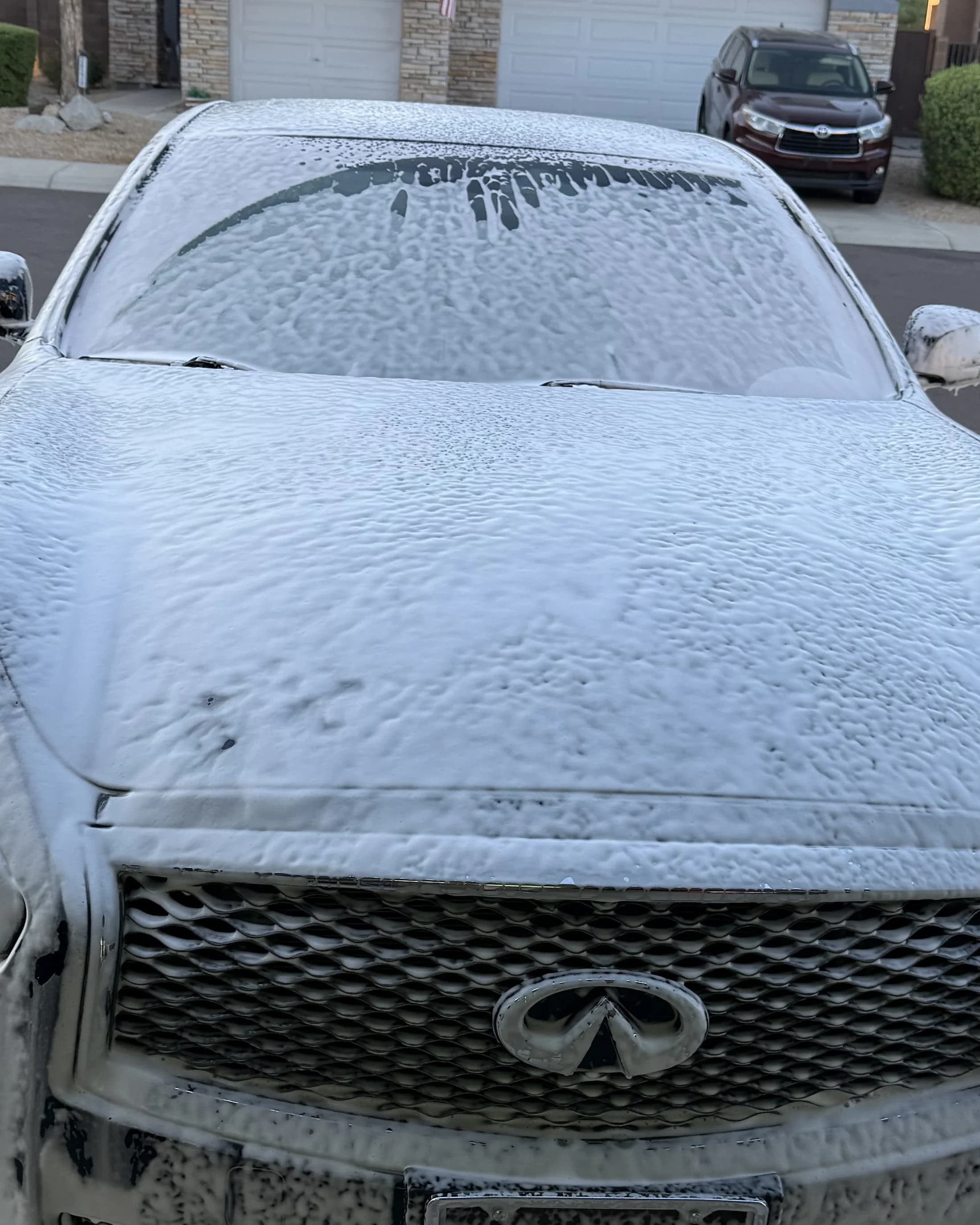 Foam wash process on a vehicle front end.