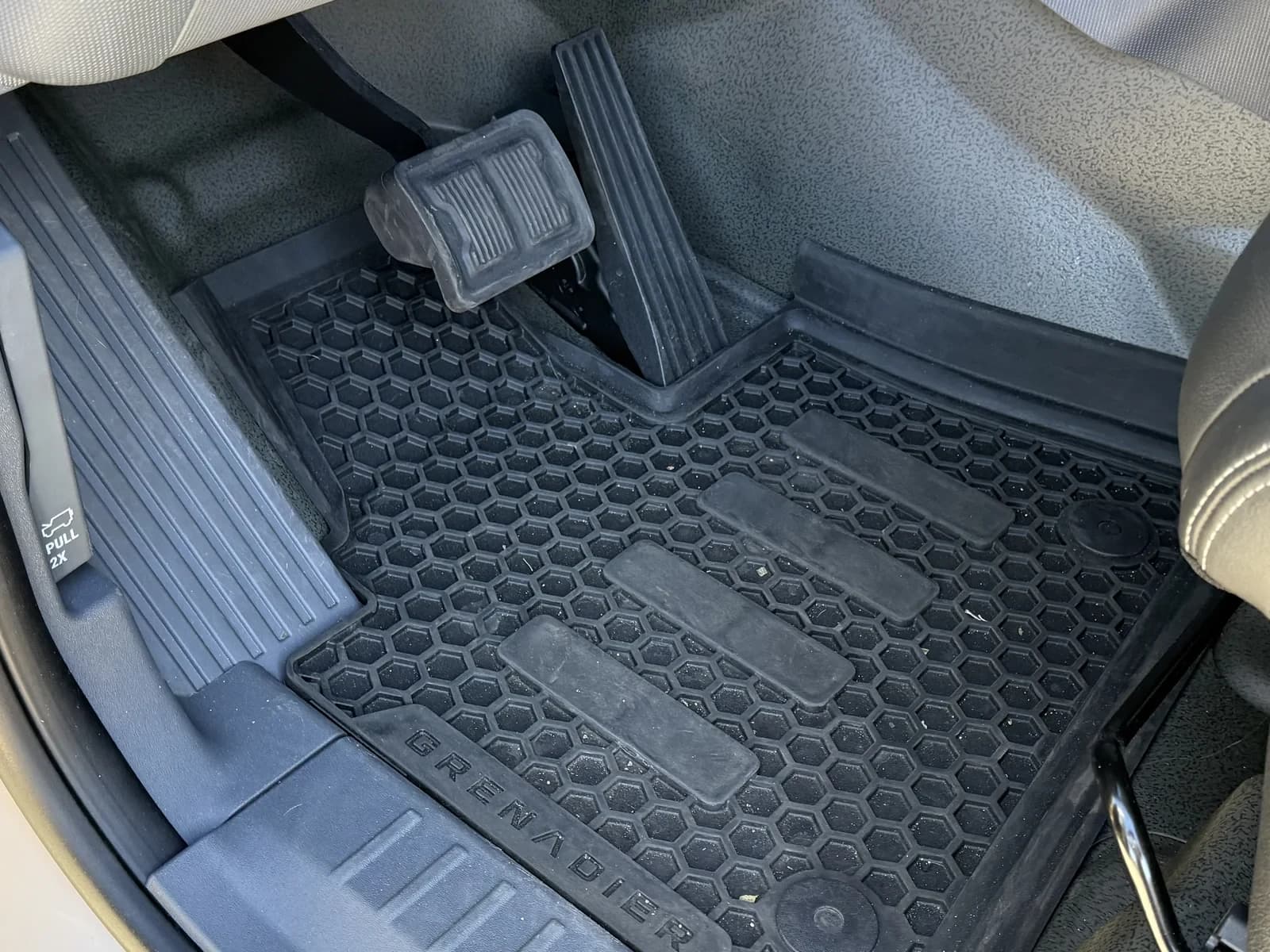 Clean vehicle footwell and floor mat after interior detailing.