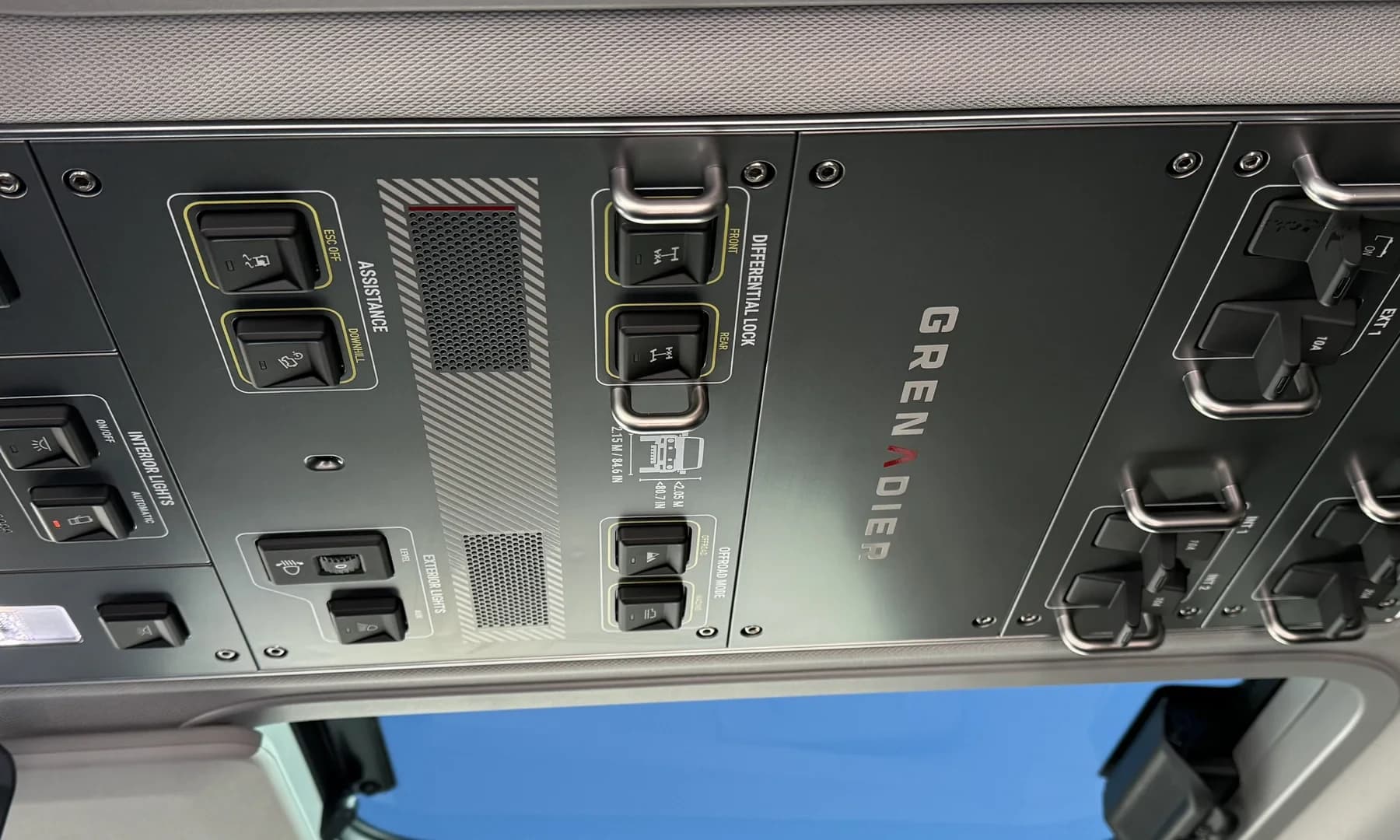 Detailed overhead vehicle controls and trim after interior cleaning.