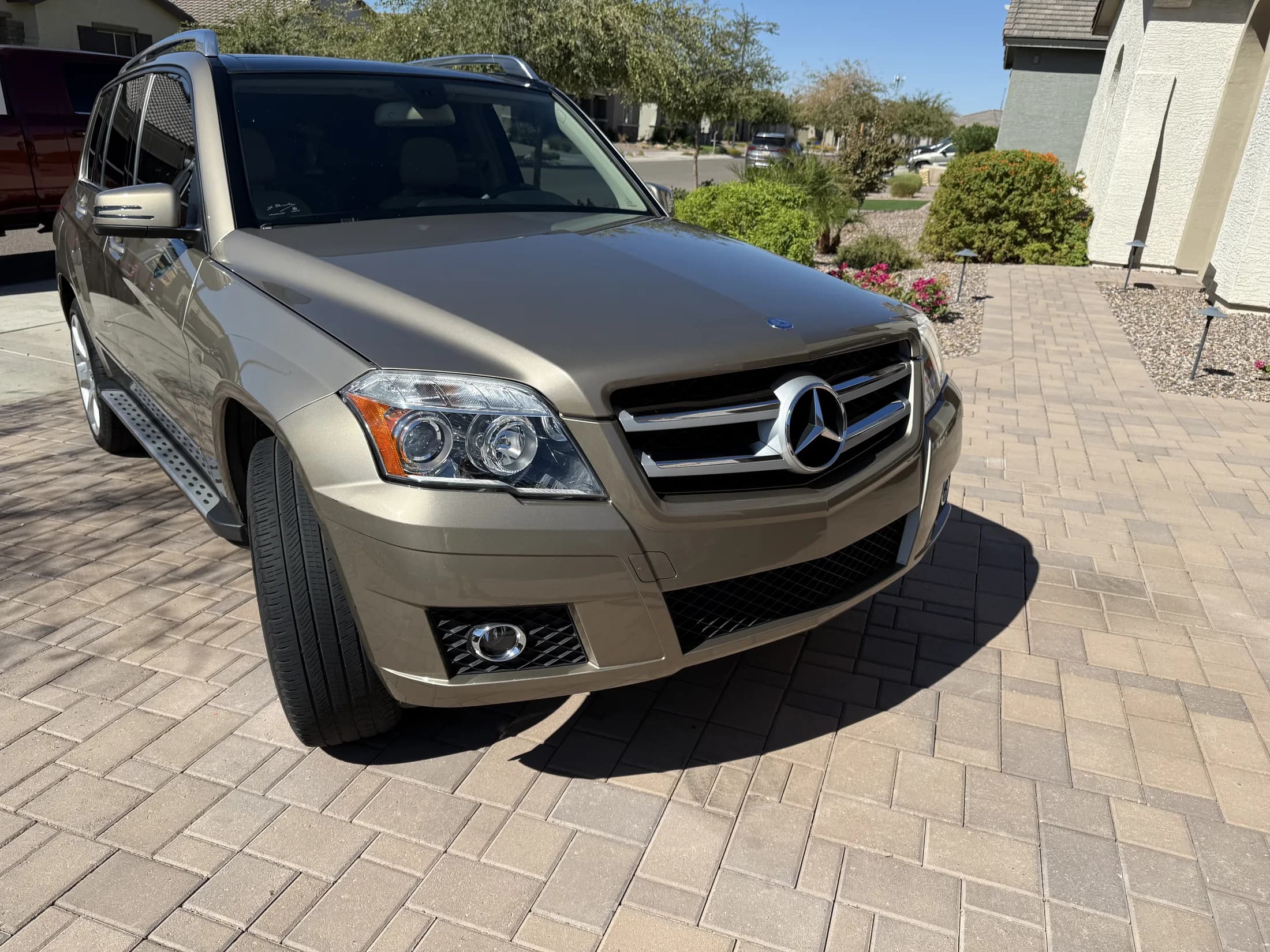 Mercedes GLK front end with clear projector headlamps after detailing.
